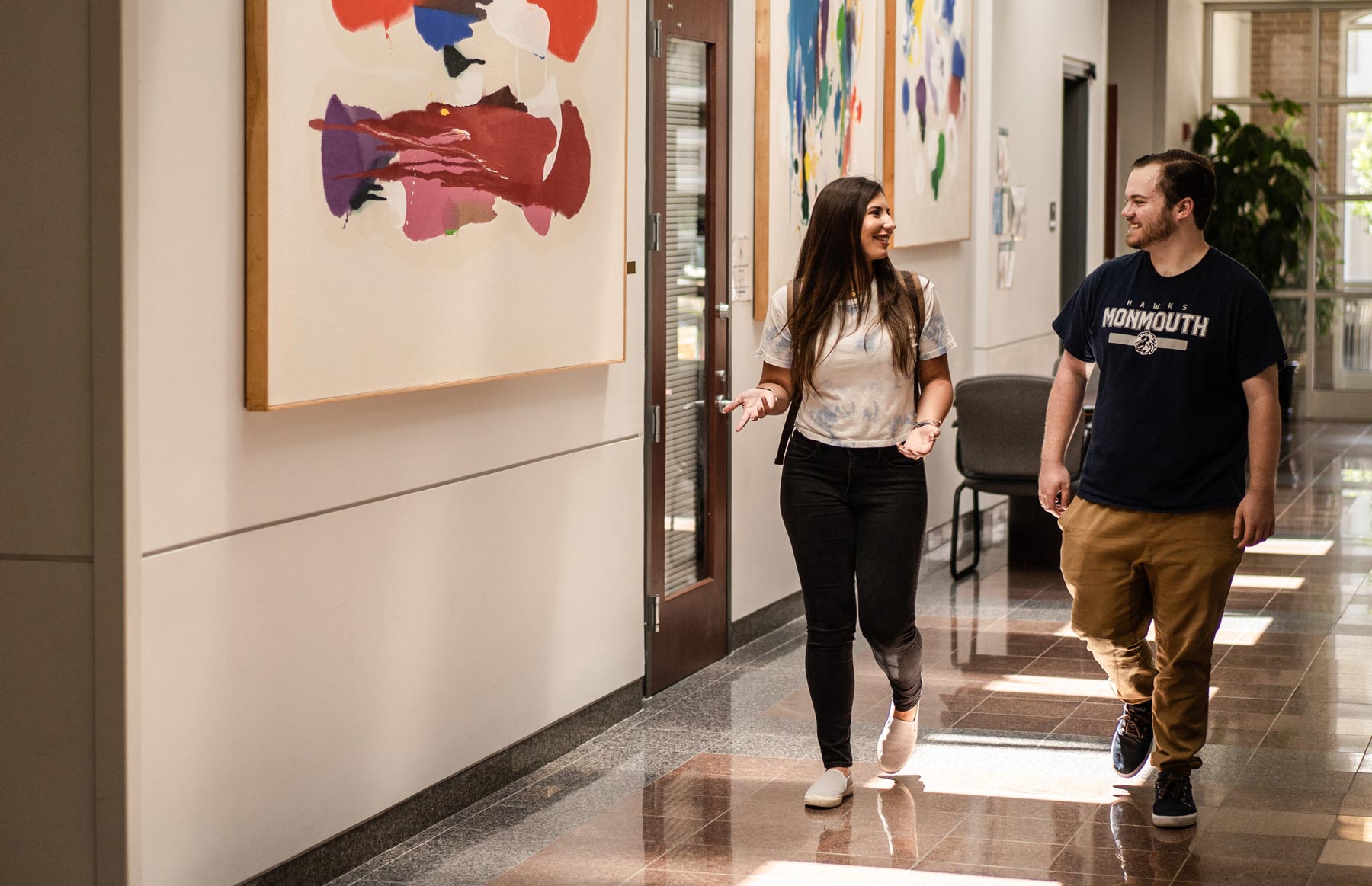Students walking through plangere lobby