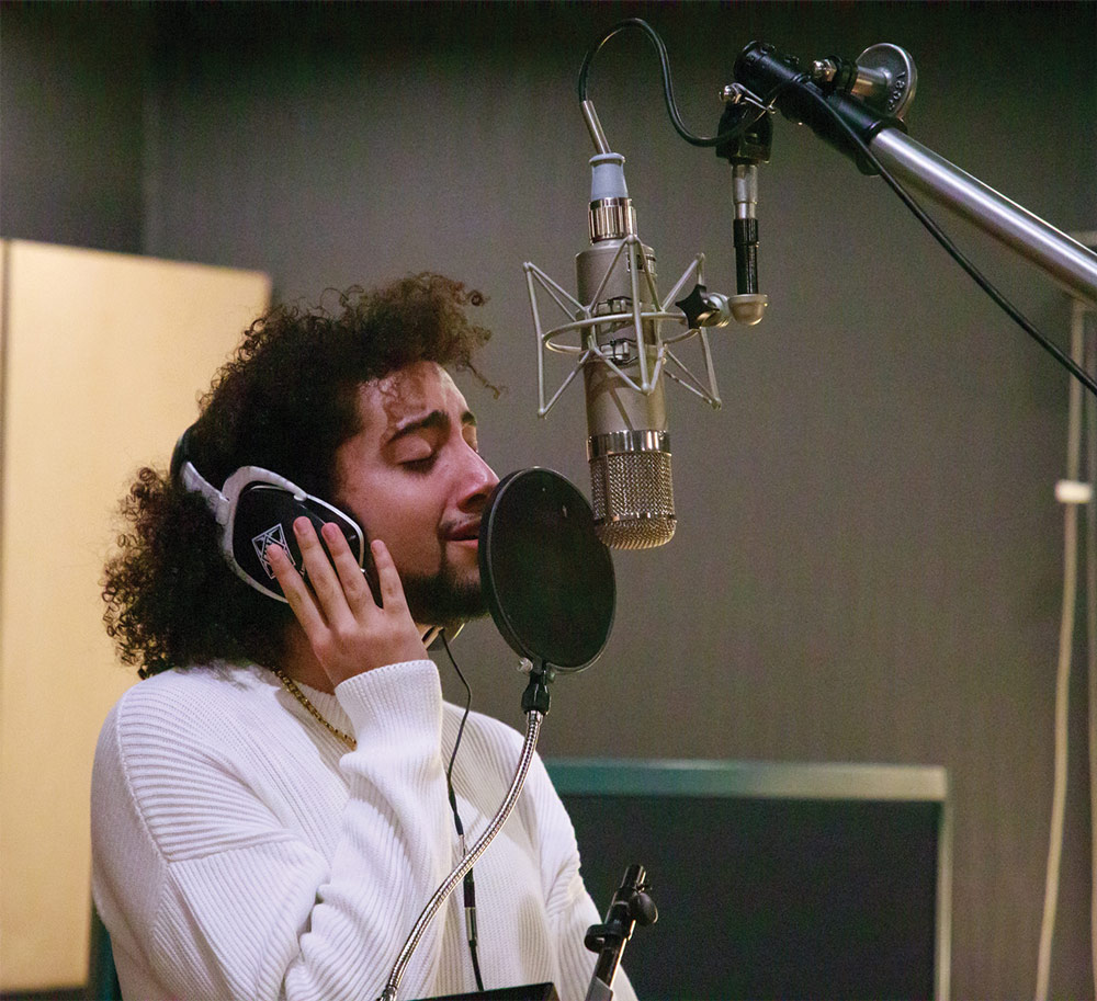 student singing in recording studio