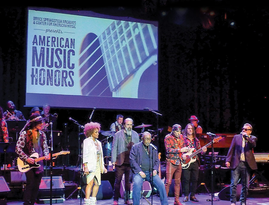 candid shot of performers on stage at an American Music Honors event