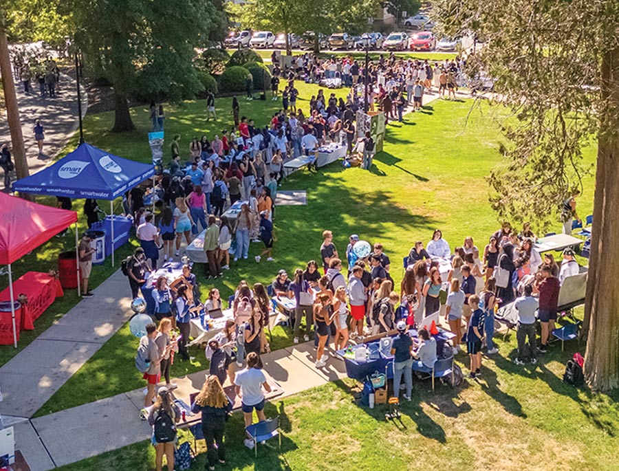drone view of a Monmouth quad filled with students participating in a recruitment like event